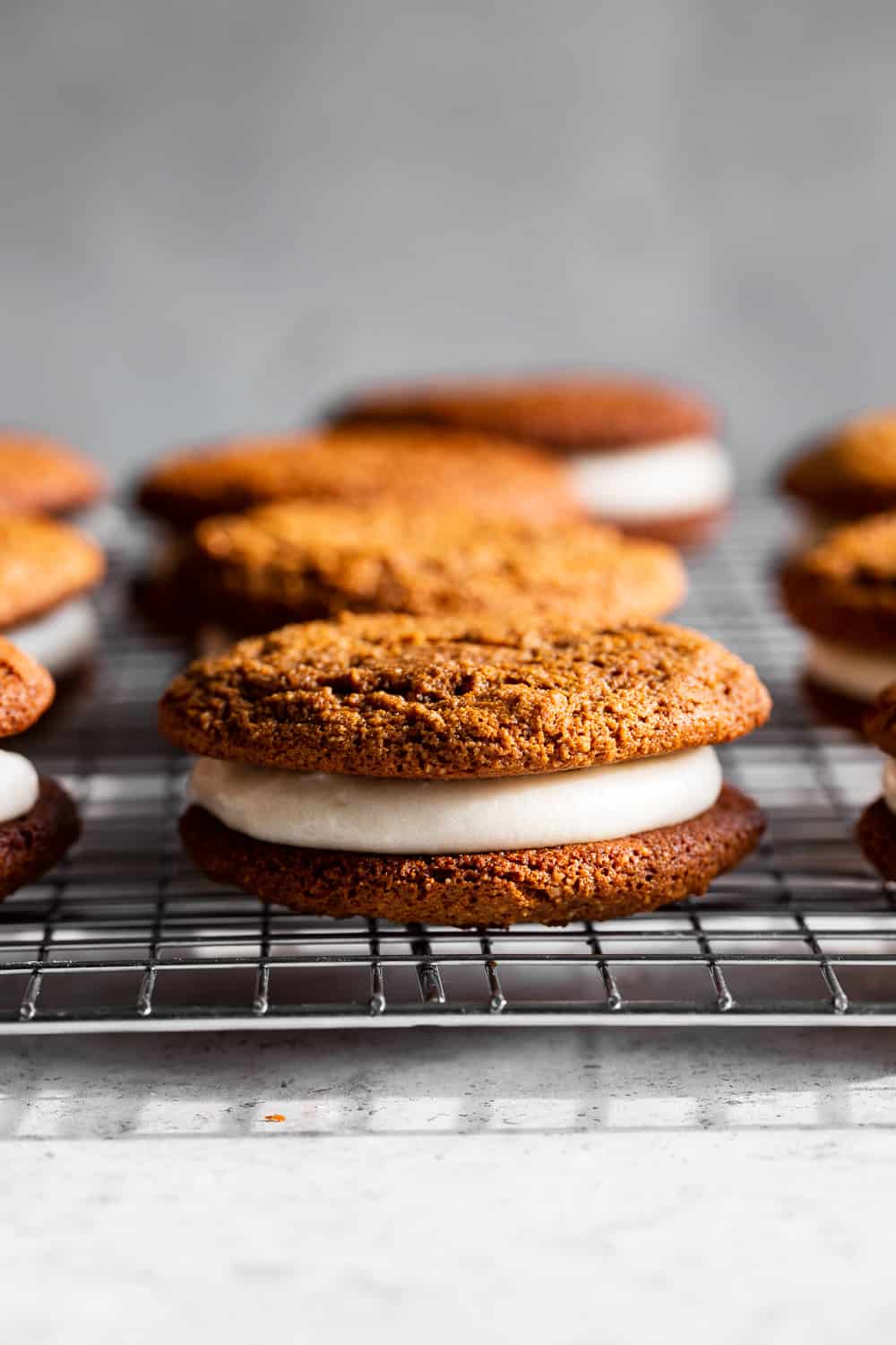 These grain free Gingerbread Whoopie Pies have loads of molasses flavor with warm spices and a soft cream cheese filling with a dairy free option. They’re gluten free, paleo friendly, easy to prepare and an extra special treat for the holiday season! #paleo #grainfree #paleobaking #glutenfree #glutenfreebaking