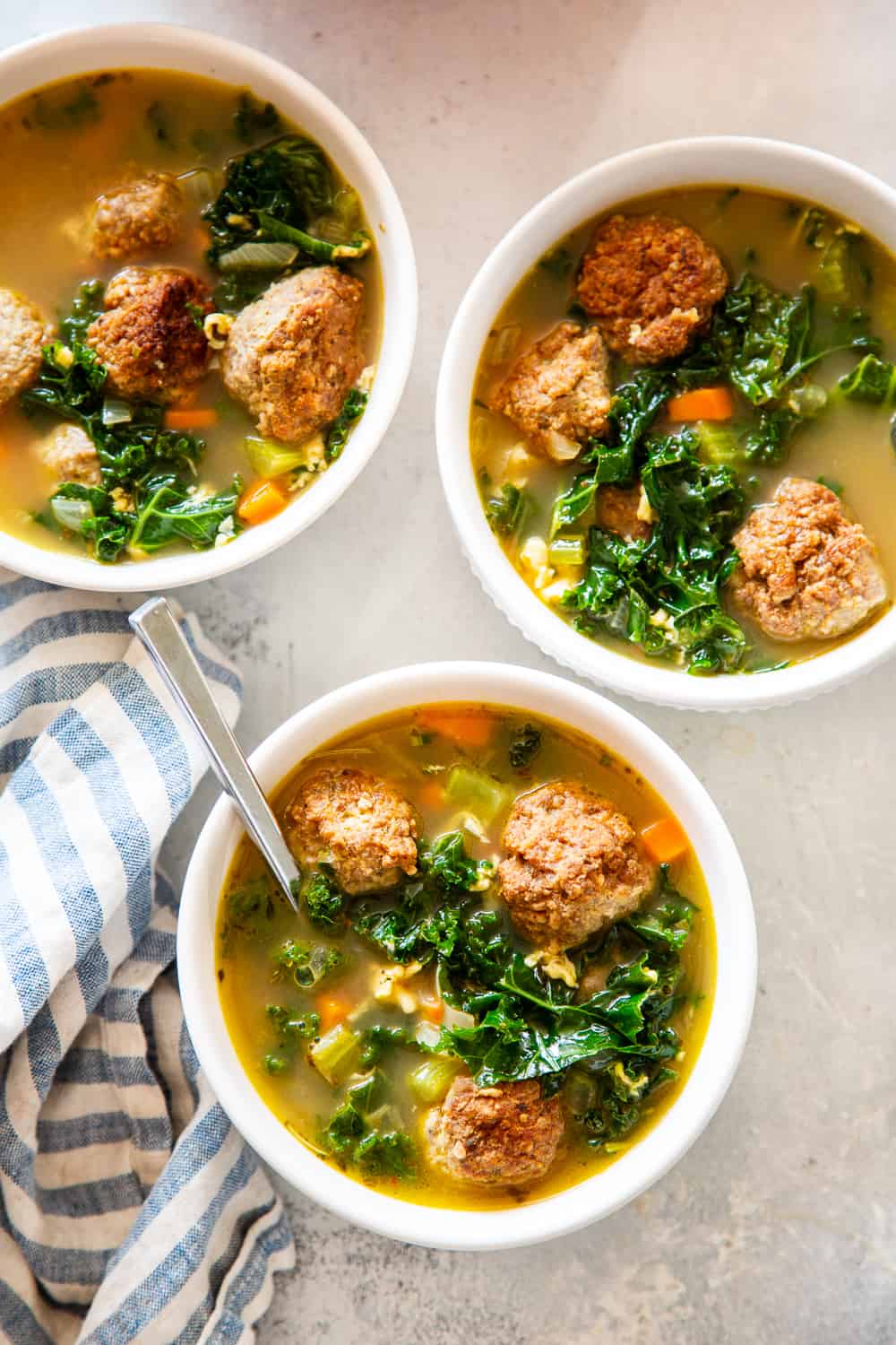 This Paleo Italian Wedding Soup is the perfect cozy comfort food! It’s easy to make, packed with the tastiest Italian sausage meatballs and plenty of veggies. It’s grain free, Whole30 friendly and keto. #paleo #whole30 #keto #cleaneating #soup