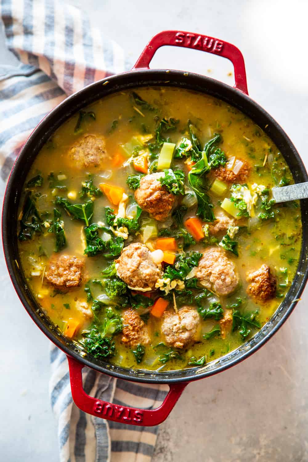 This Paleo Italian Wedding Soup is the perfect cozy comfort food! It’s easy to make, packed with the tastiest Italian sausage meatballs and plenty of veggies. It’s grain free, Whole30 friendly and keto. #paleo #whole30 #keto #cleaneating #soup