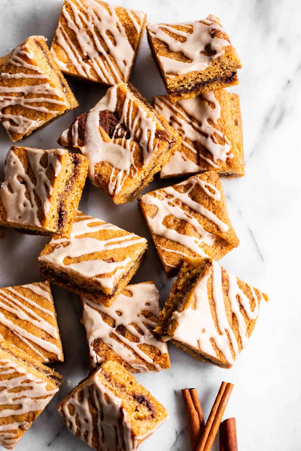 These snickerdoodle blondies have a sweet cinnamon layer between two chewy vanilla cookie blondie layers, plus a cinnamon icing. They’re refined sugar free, paleo, gluten free and have a dairy free option. #paleo #cleaneating #paleobaking #glutenfree #glutenfreebaking #christmascookies