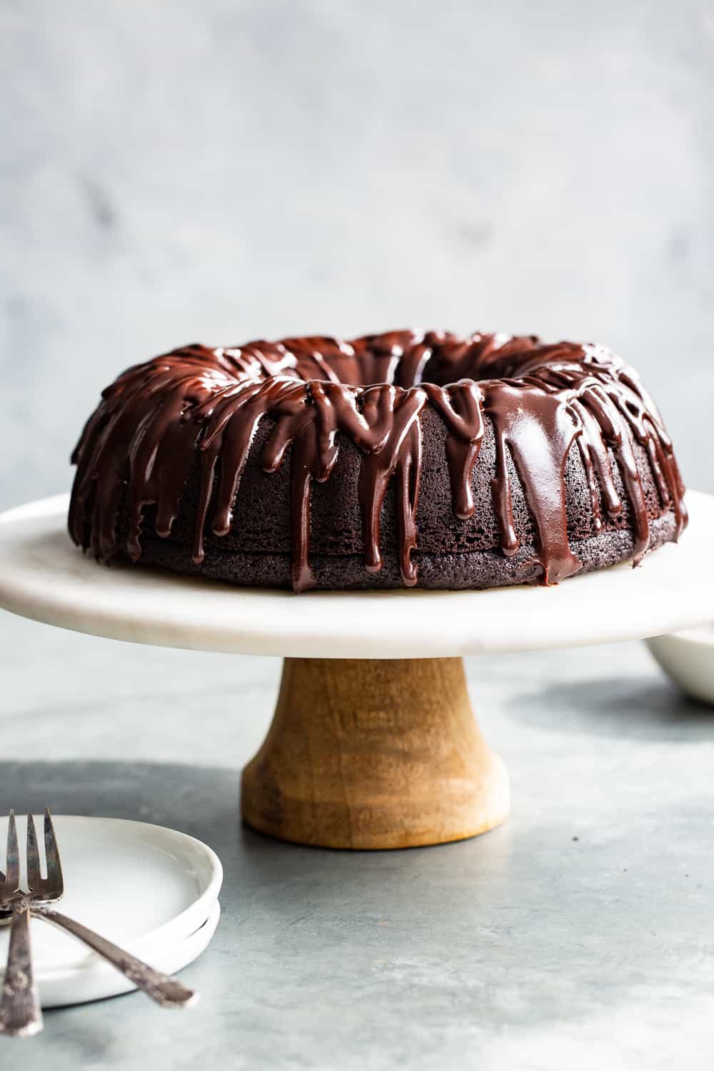 This ultra rich paleo chocolate bundt cake is easier than expected and perfect for any special occasion. A grain free, gluten free and dairy free perfectly moist chocolate cake is topped with an easy dairy free chocolate ganache. Win over any chocolate lover with the first bite! #paleo #grainfree #cleaneating #glutenfree 