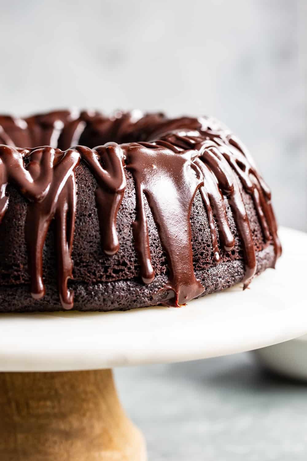This ultra rich paleo chocolate bundt cake is easier than expected and perfect for any special occasion. A grain free, gluten free and dairy free perfectly moist chocolate cake is topped with an easy dairy free chocolate ganache. Win over any chocolate lover with the first bite! #paleo #grainfree #cleaneating #glutenfree 