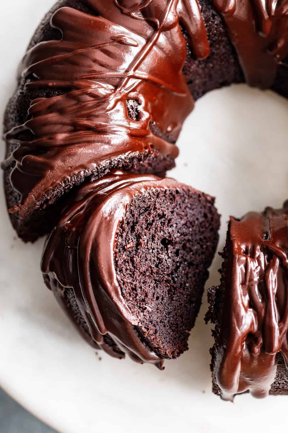 This ultra rich paleo chocolate bundt cake is easier than expected and perfect for any special occasion. A grain free, gluten free and dairy free perfectly moist chocolate cake is topped with an easy dairy free chocolate ganache. Win over any chocolate lover with the first bite! #paleo #grainfree #cleaneating #glutenfree 