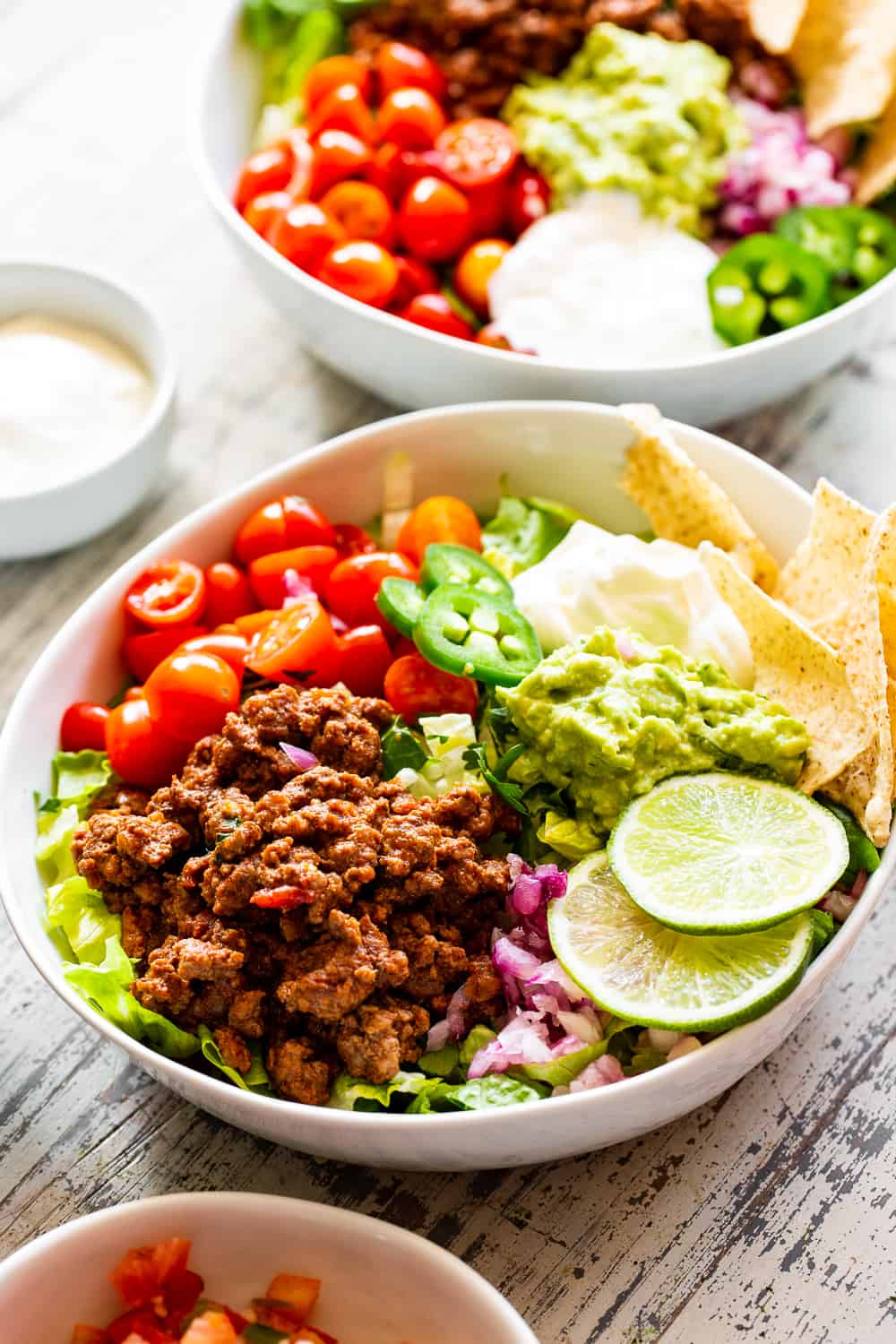 This easy, flavor packed paleo taco salad is ready in 20 minutes from start to finish and great for an easy weeknight dinner! Whole30 and keto options. #paleo #whole30 #keto #cleaneating 