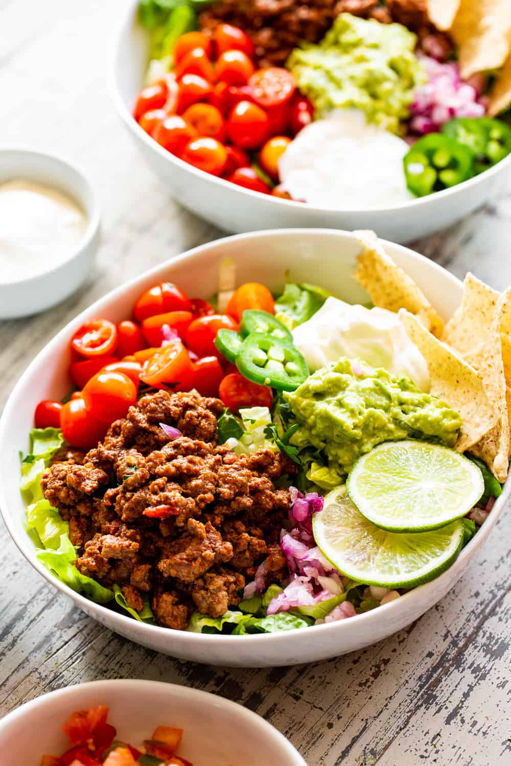 This easy, flavor packed paleo taco salad is ready in 20 minutes from start to finish and great for an easy weeknight dinner! Whole30 and keto options. #paleo #whole30 #keto #cleaneating 