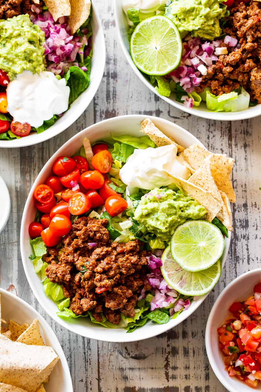 This easy, flavor packed paleo taco salad is ready in 20 minutes from start to finish and great for an easy weeknight dinner! Whole30 and keto options. #paleo #whole30 #keto #cleaneating 