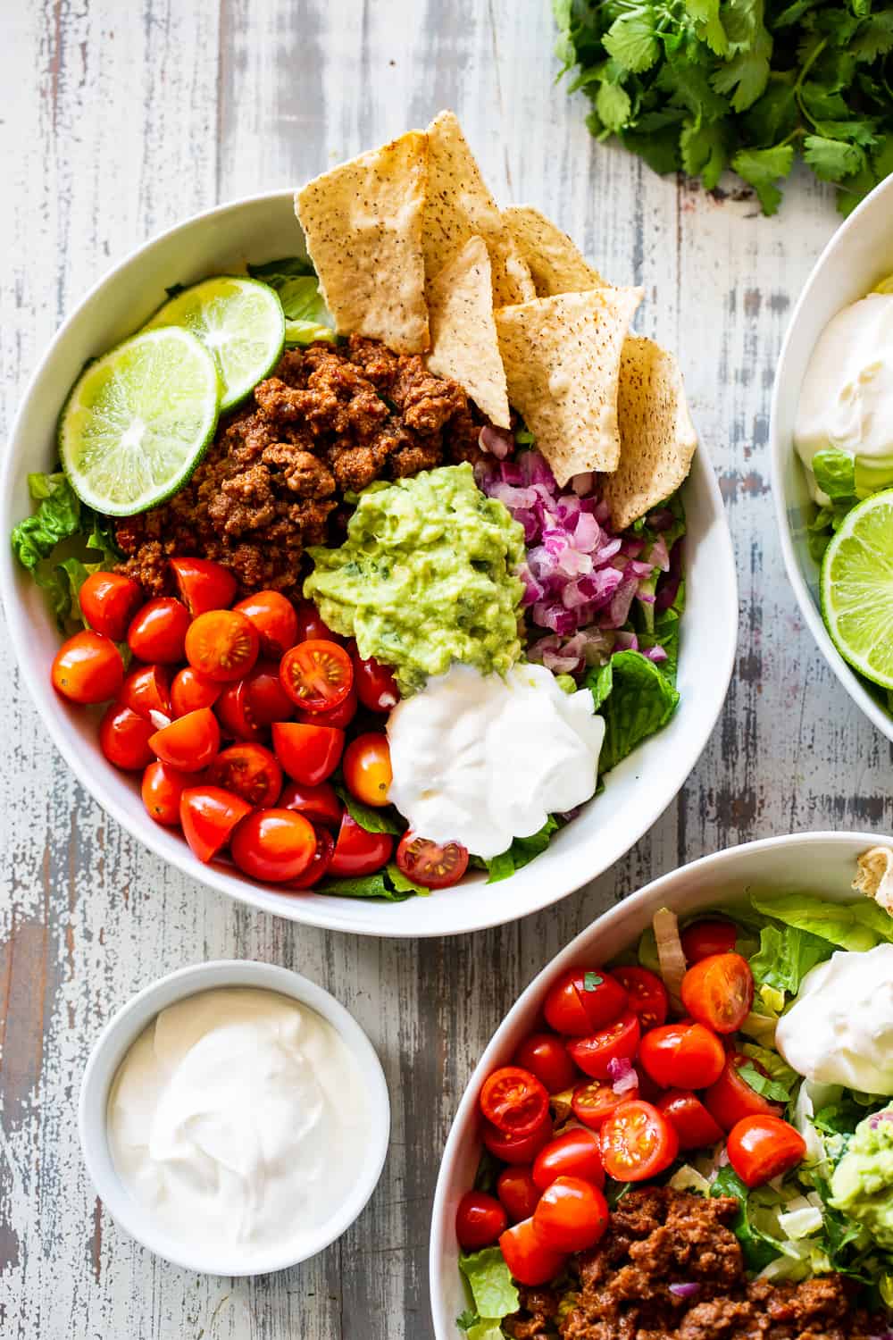 This easy, flavor packed paleo taco salad is ready in 20 minutes from start to finish and great for an easy weeknight dinner! Whole30 and keto options. #paleo #whole30 #keto #cleaneating 