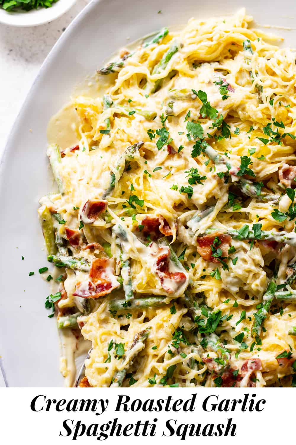 This roasted garlic spaghetti squash has a creamy savory sauce with crispy bacon plus sautéed asparagus. It’s flavor packed, low in carbs, paleo and Whole30 friendly. #paleo #whole30 #keto #lowcarb #cleaneating