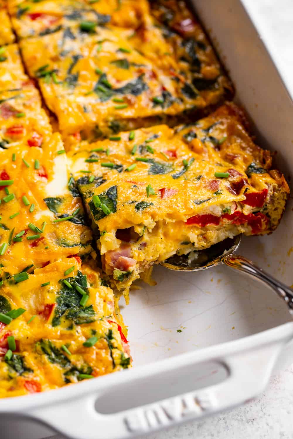 This ham and veggie breakfast casserole is a savory breakfast dream! Packed with protein and veggies, it’s easy to throw together and great to prep ahead of time. Paleo, grain free and dairy free with a Whole30 option, family approved and awesome as breakfast for dinner! #paleo #whole30 #cleaneating