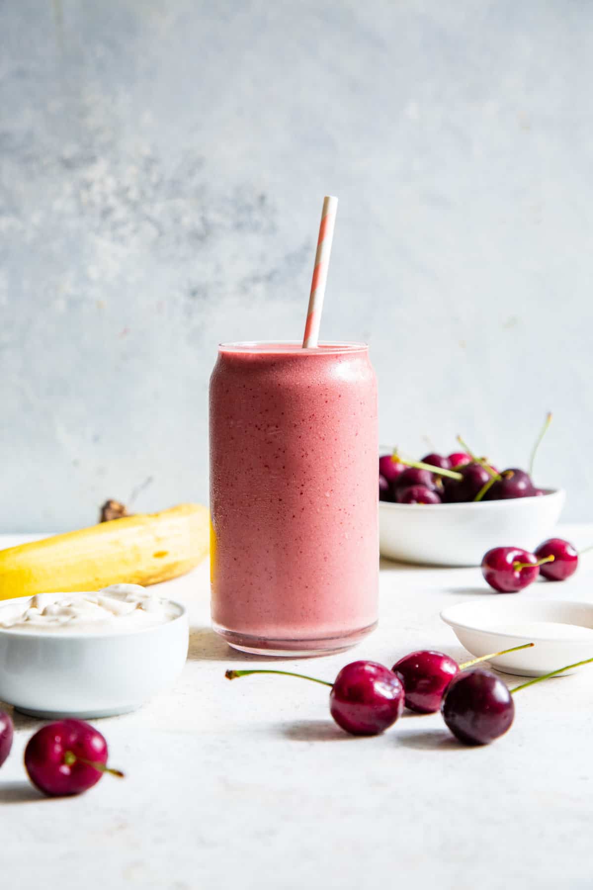 Person making cherry smoothie with a blender isolated Stock Photo