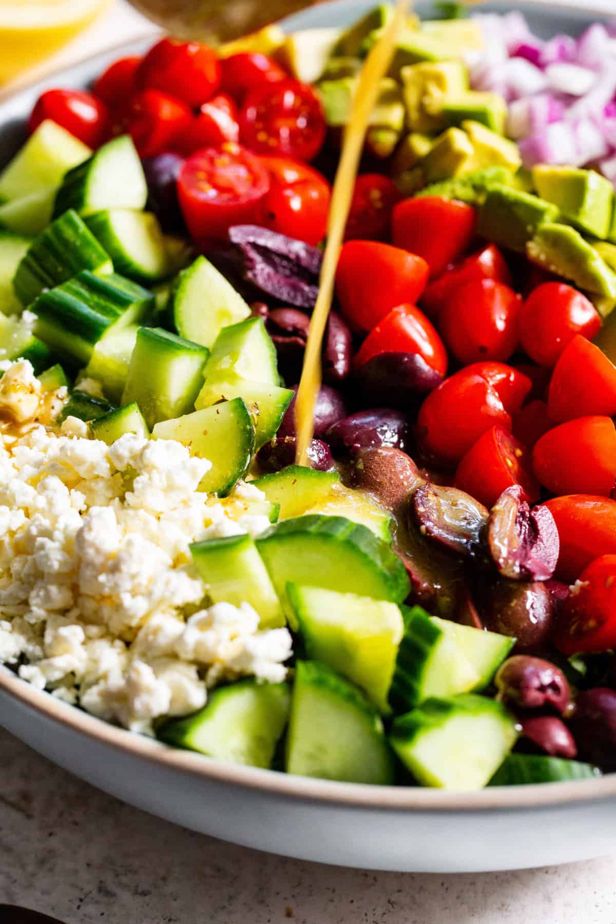 This mediterranean chopped salad has loads of veggies, a flavor packed vinaigrette and vegan feta cheese. It’s perfect to serve to guests, for BBQs, picnics or a light lunch. Make it a full meal by topping with chopped chicken or other protein. Paleo and vegan