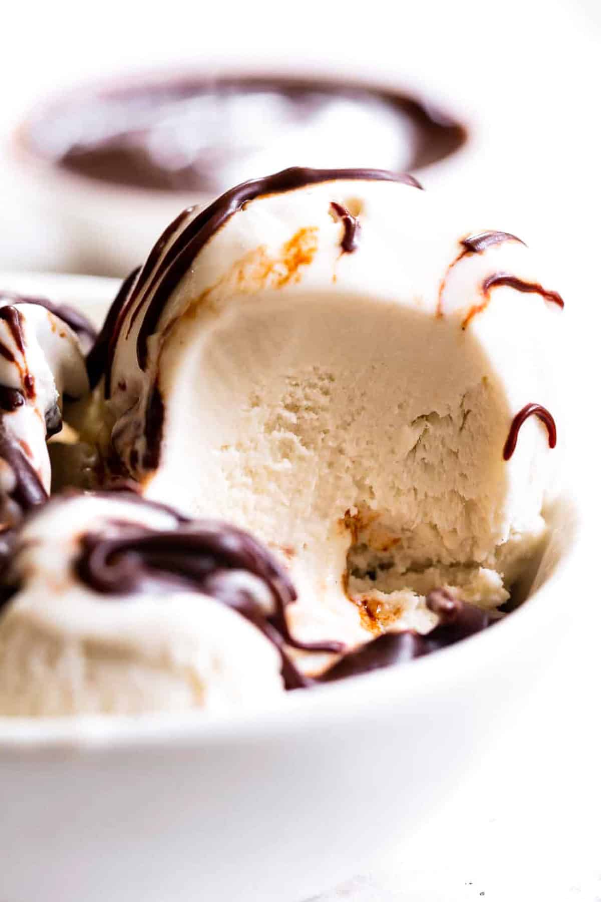 paleo vanilla ice cream close up scoop with chocolate syrup