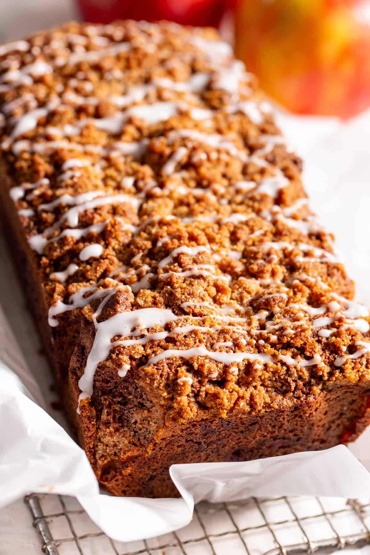 Apple cinnamon bread with cinnamon crumble topping and vanilla icing drizzle