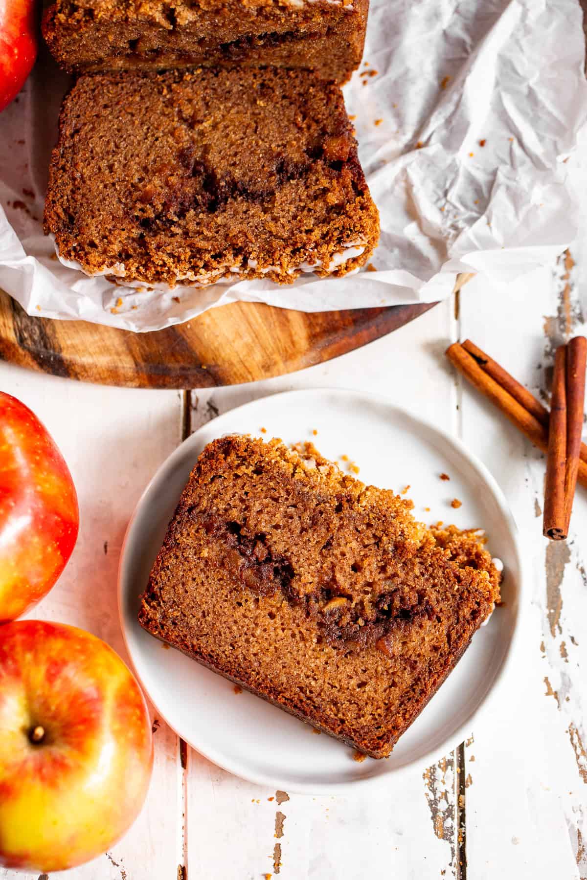 Slice of moist apple cinnamon bread with a cinnamon apple swirl and crumble topping