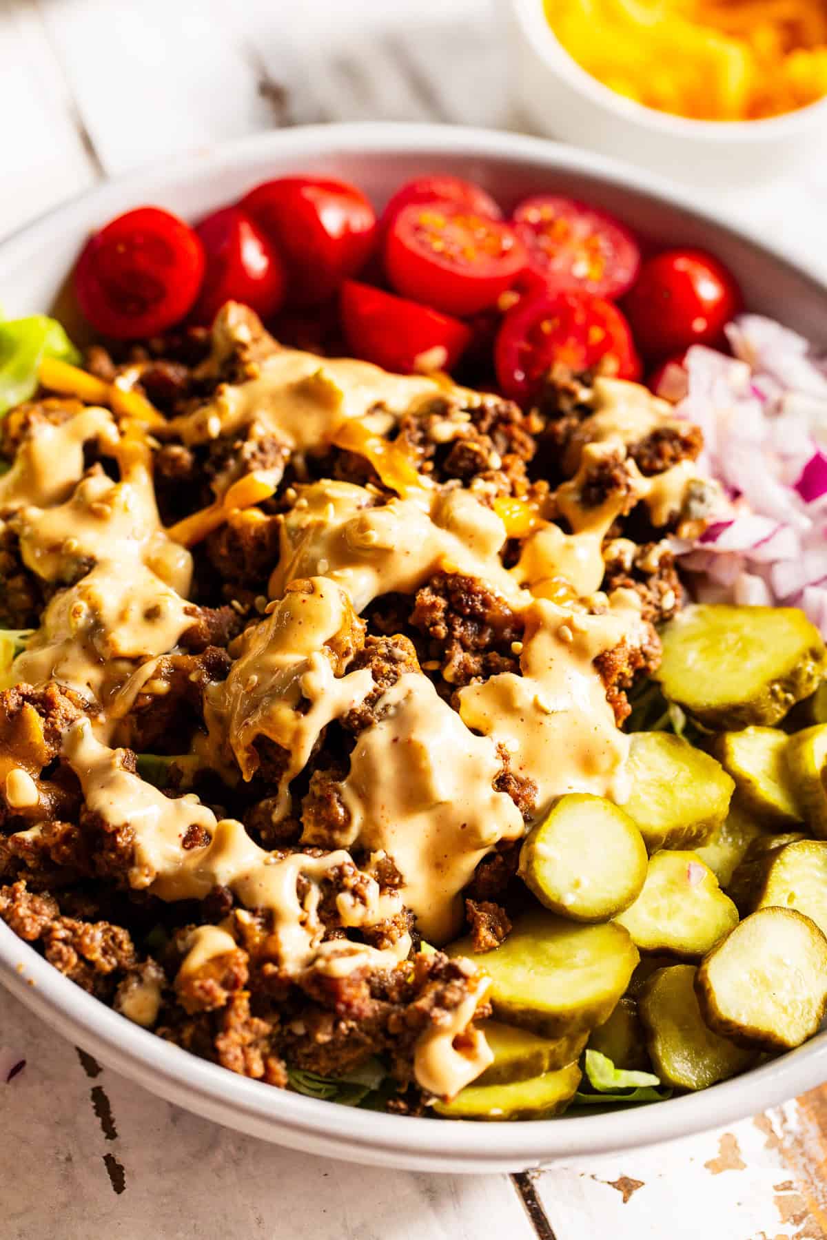 High protein Big Mac bowls with ground beef, cheddar cheese, pickles and special sauce