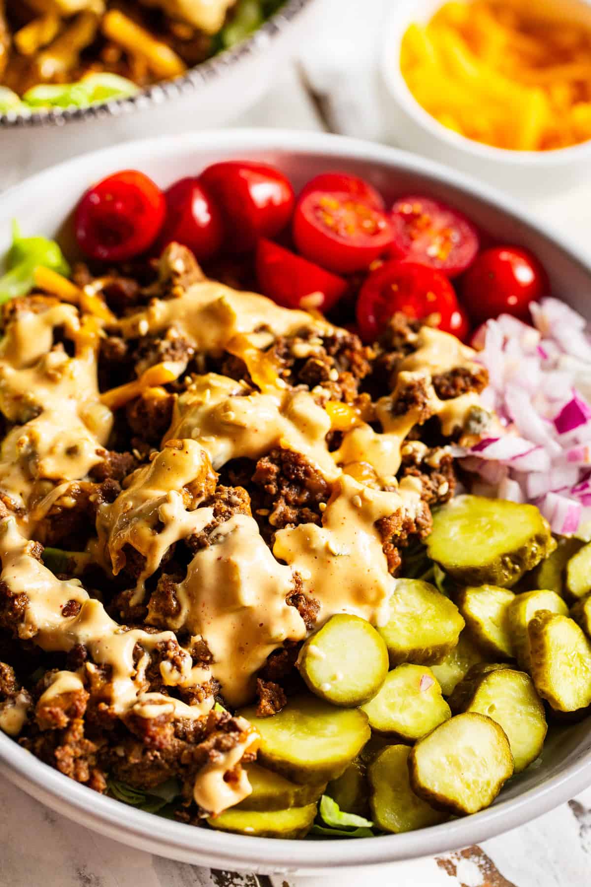 High protein Big Mac bowls with ground beef, cheddar cheese, pickles and special sauce