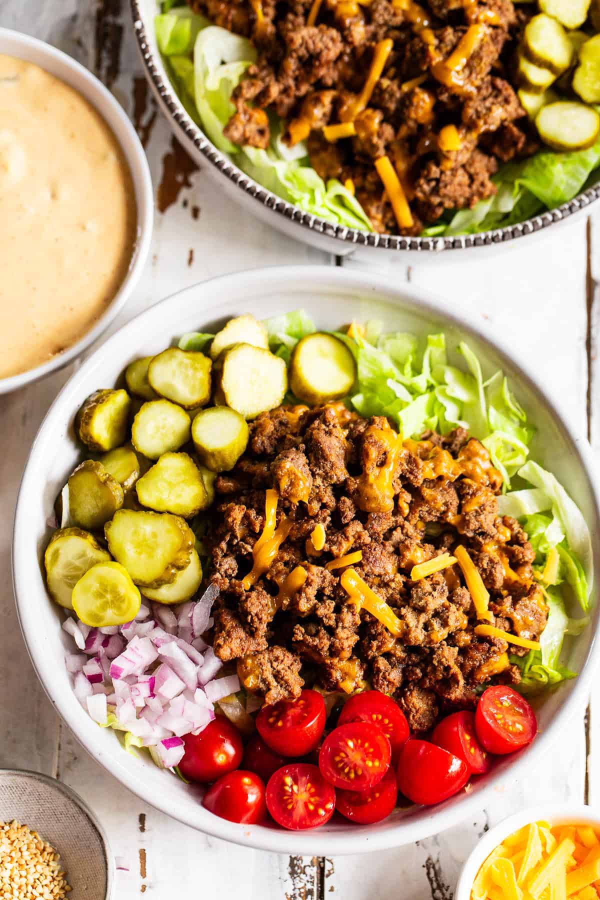 High protein Big Mac bowls with ground beef, cheddar cheese, pickles and special sauce
