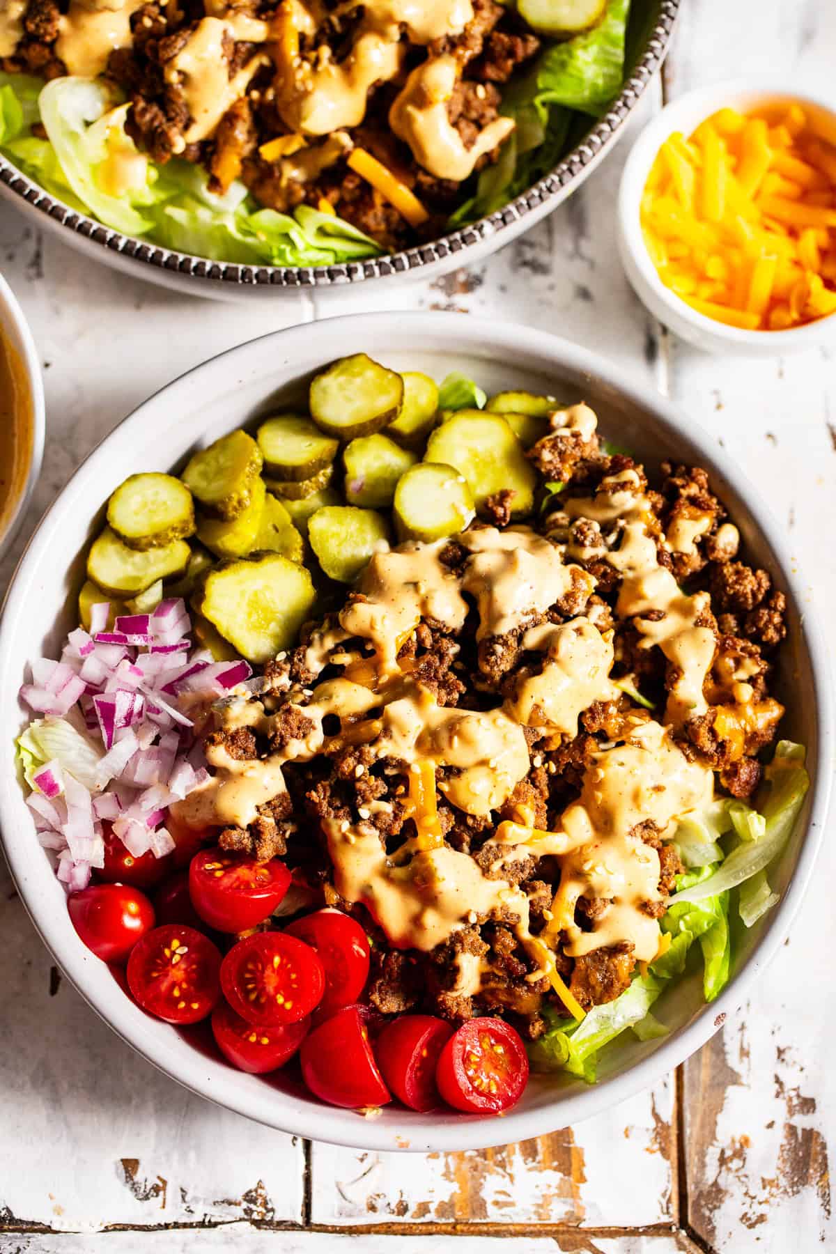 High protein Big Mac bowls with ground beef, cheddar cheese, pickles and special sauce