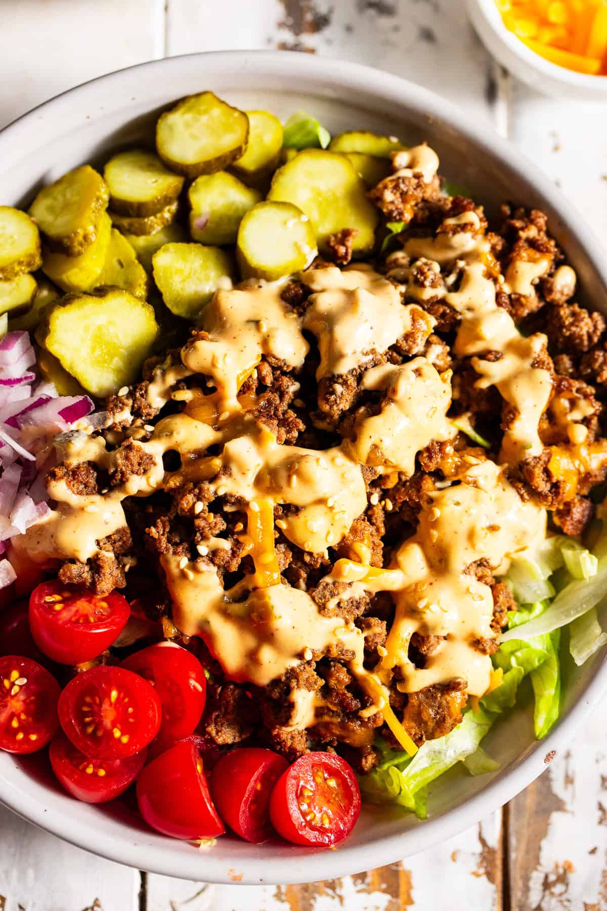 High protein Big Mac bowls with ground beef, cheddar cheese, pickles and special sauce
