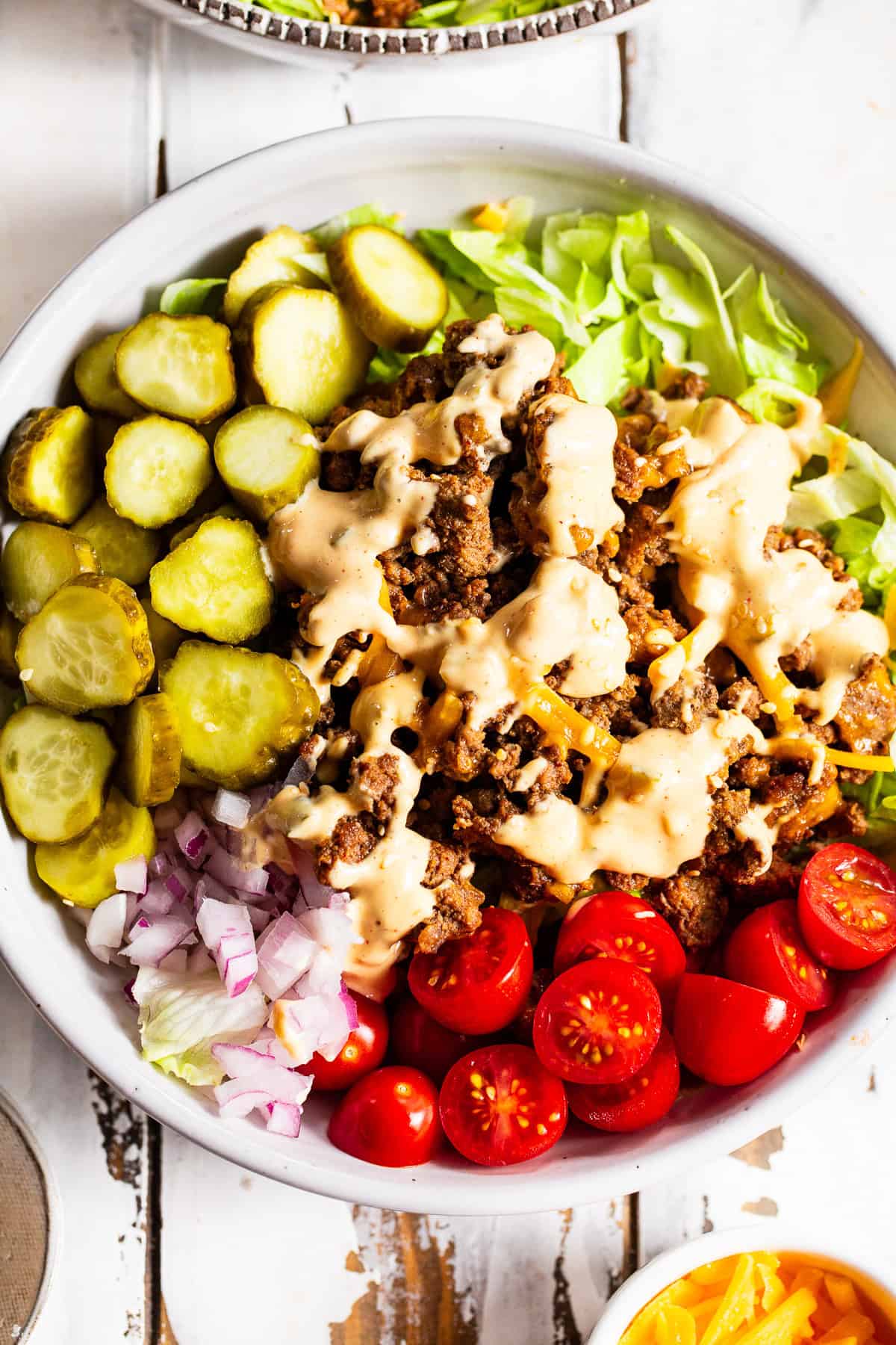 High protein Big Mac bowls with ground beef, cheddar cheese, pickles and special sauce