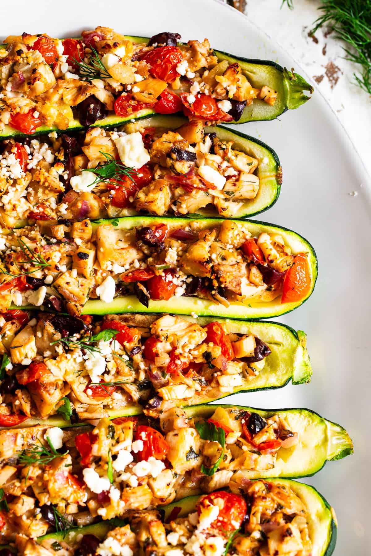Rotisserie chicken filling with tomatoes, olives, zucchini, feta and Greek seasonings