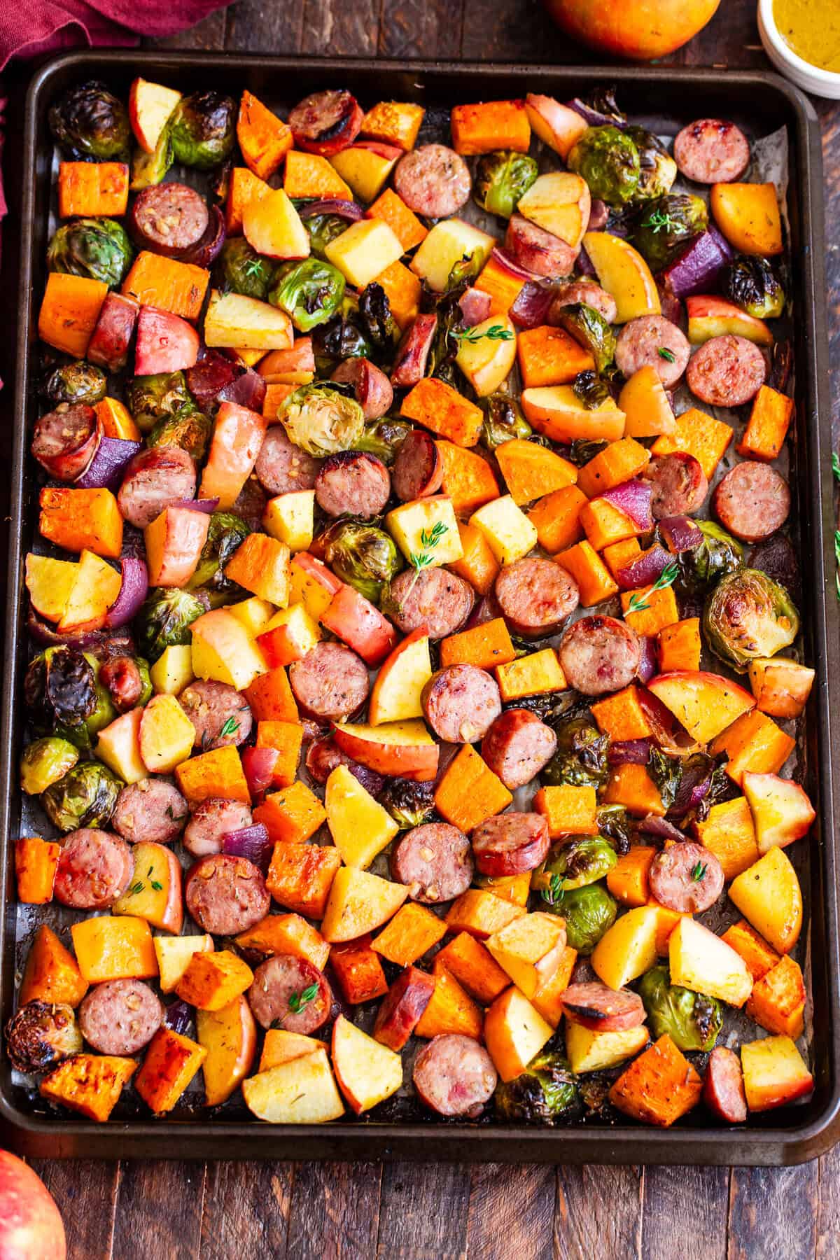 Chicken apple sausage sheet pan dinner with sweet potatoes, Brussels sprouts and apples