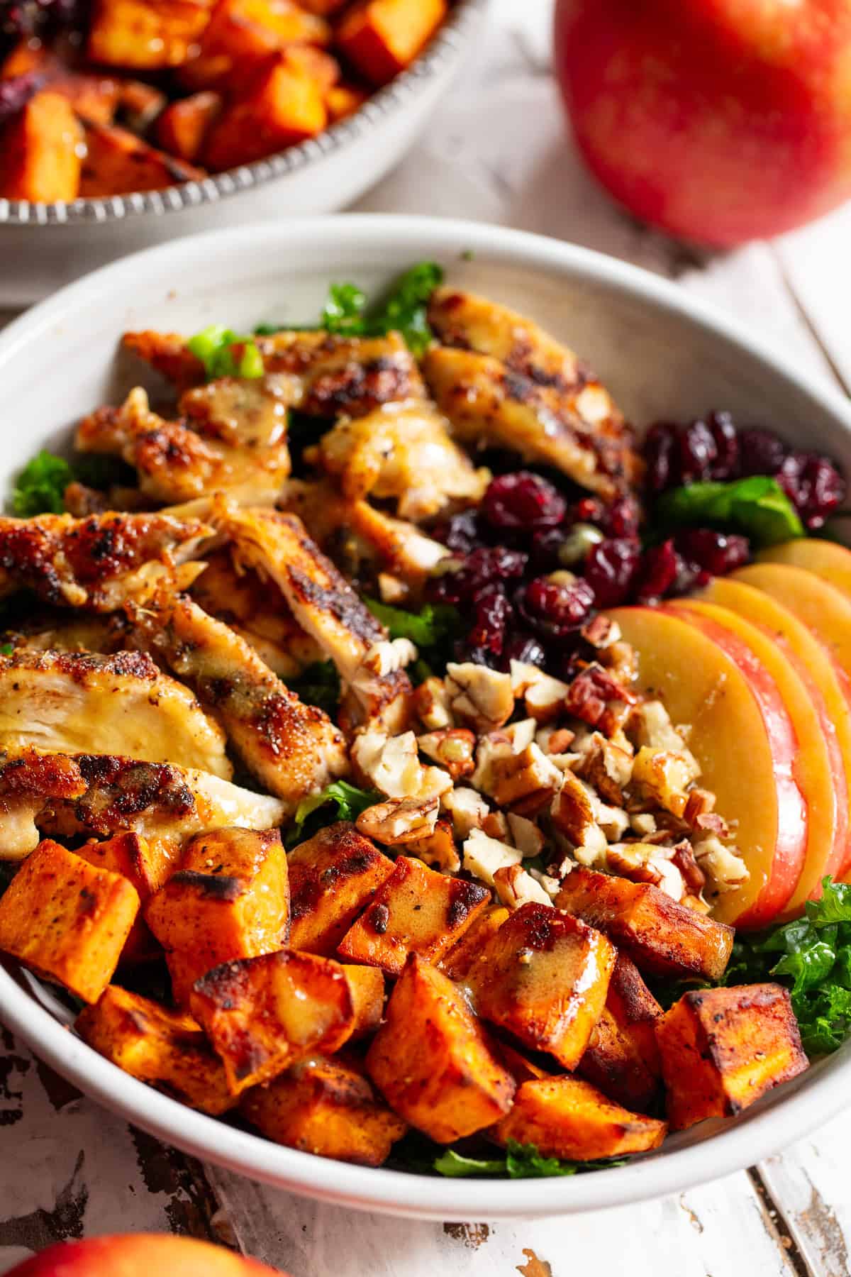 Chicken sweet potato bowl with apples and maple Dijon dressing