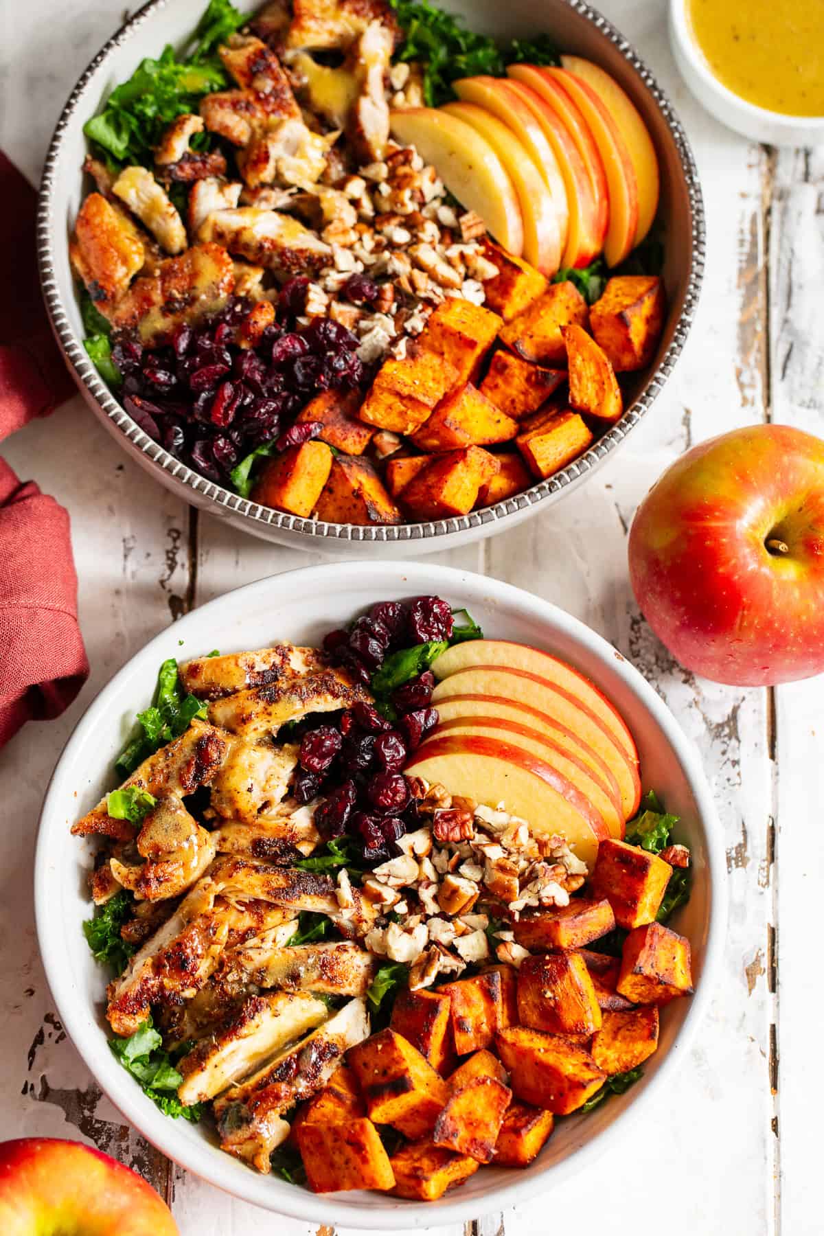 Fall chicken bowl with apples, cranberries, pecans and kale