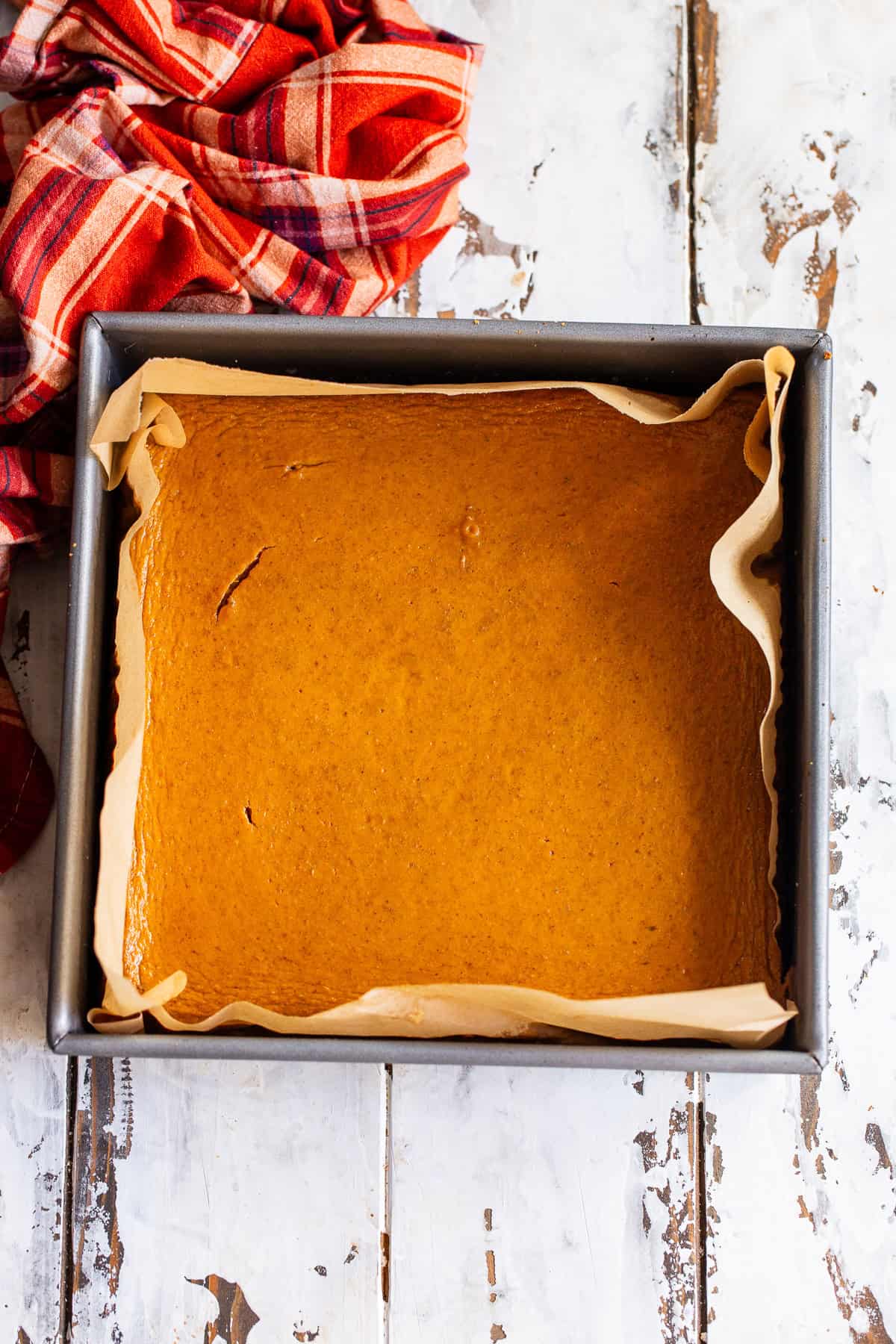 Paleo pumpkin pie bar with an almond flour crust in pan before cutting