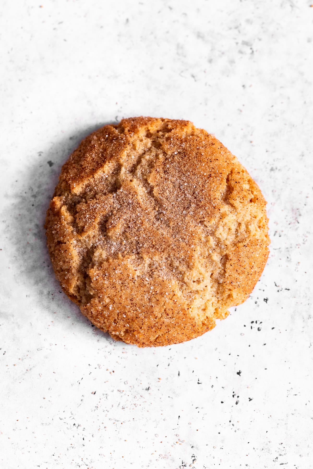 one almond flour snickerdoodle on a white background