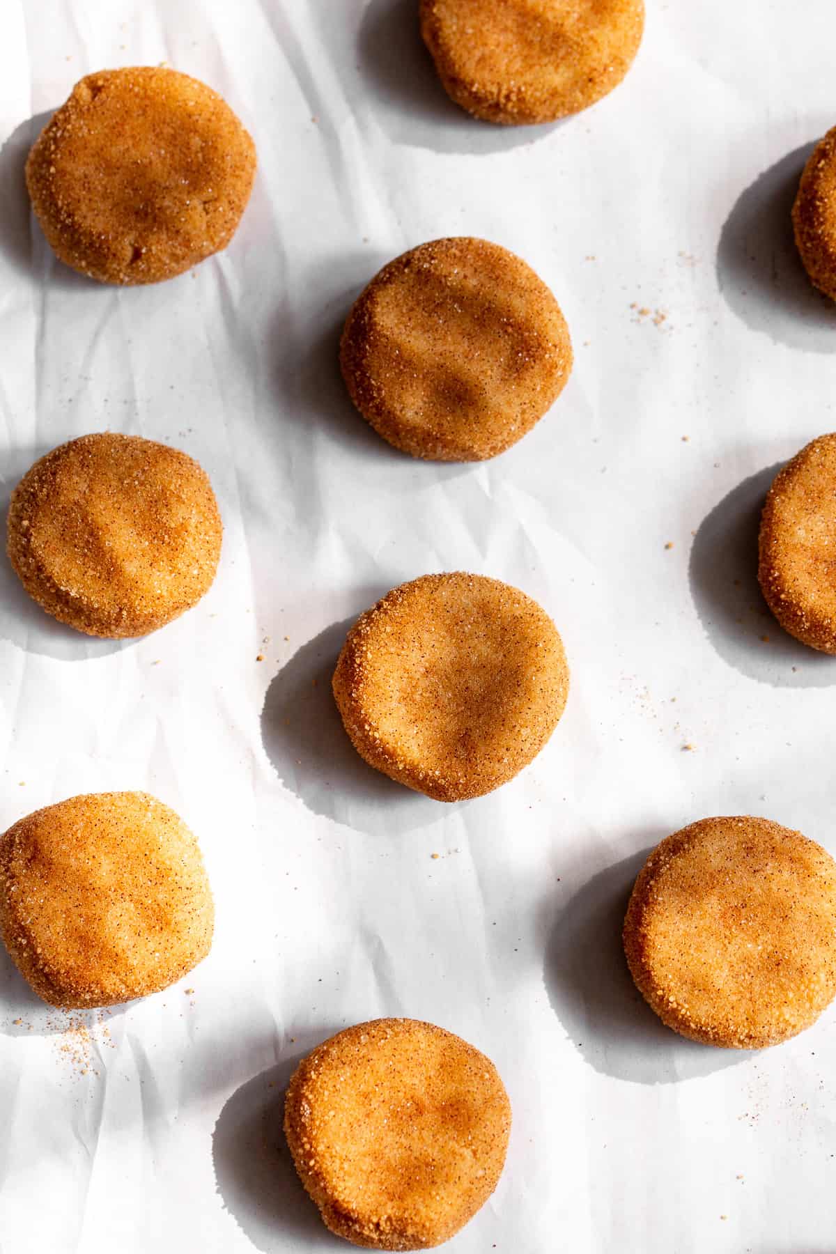 paleo snickerdoodles on a cookie sheet before baking